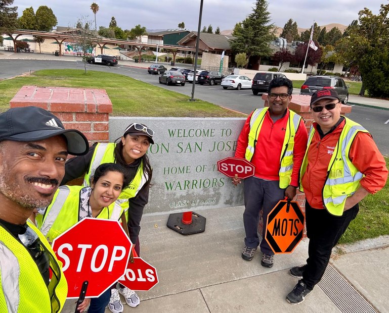 MPPFA traffic volunteers with STOP signs at Mission San Jose High School entrance
