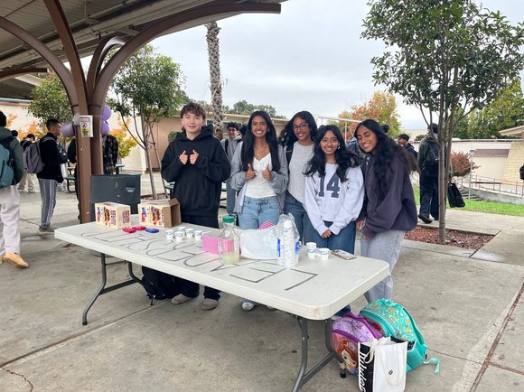 Student volunteers at Walk and Roll Day table