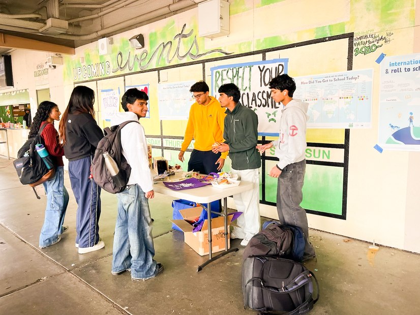 Students at Walk to School Day table inside MSJ