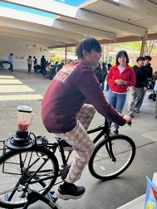 Student riding bike blender