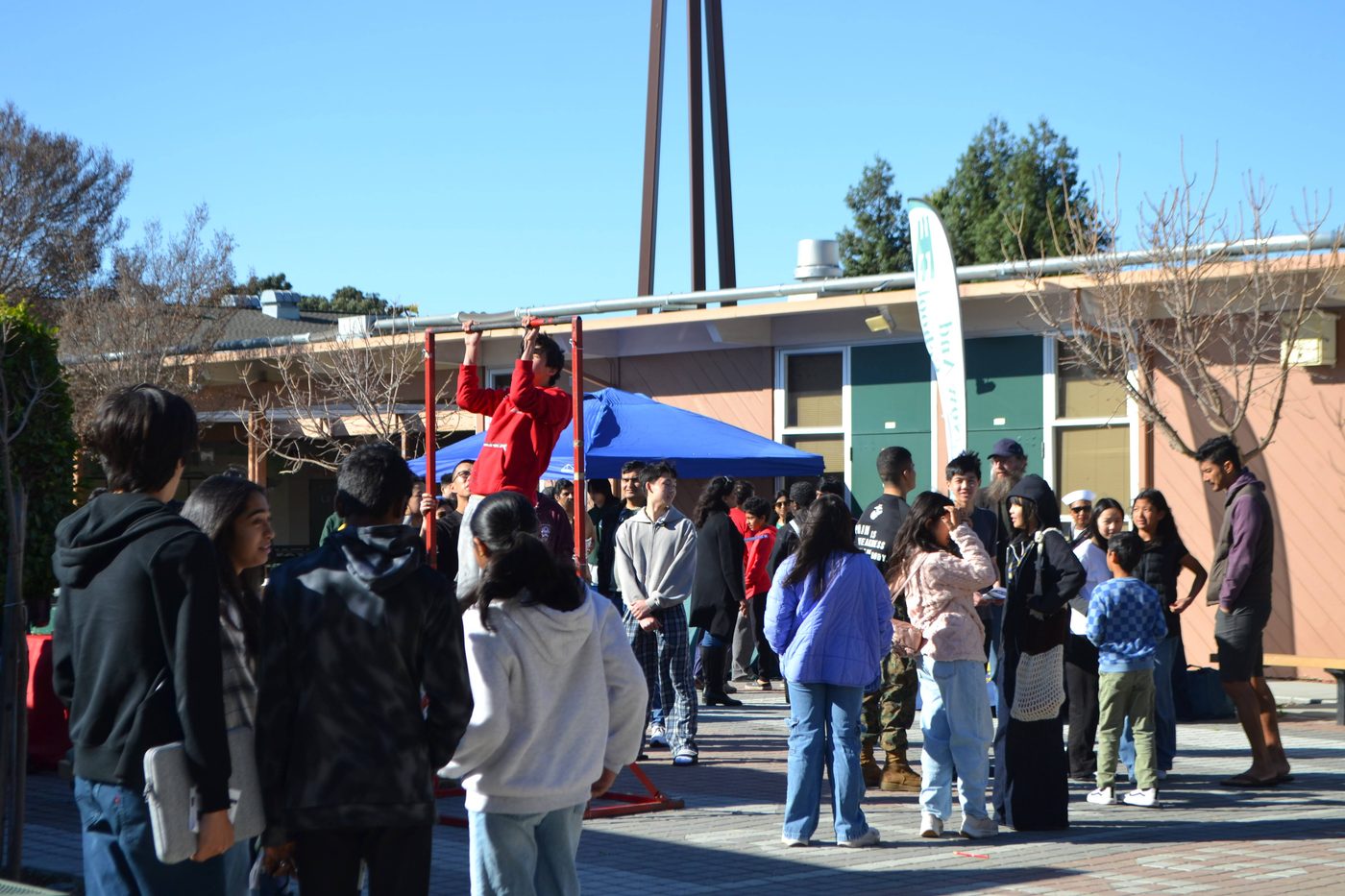 Students and families fill the MSJ courtyard at the Career Exploration Fair